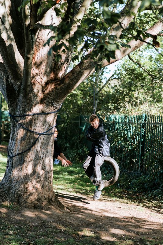 Boy on a tyre swing
